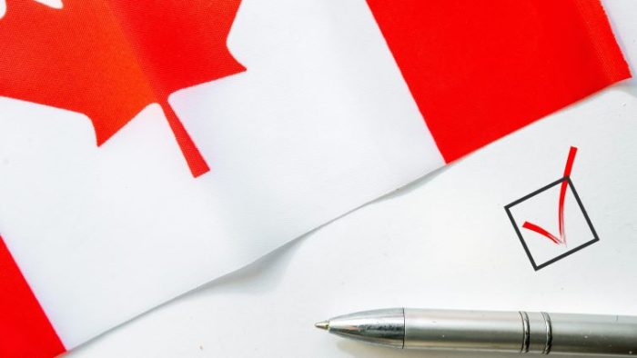 Creating a Canadian CV in 2025 – Free Template Creating a Canadian CV in 2025 - a Canadian flag with a pen and checkmark on a piece of paper.